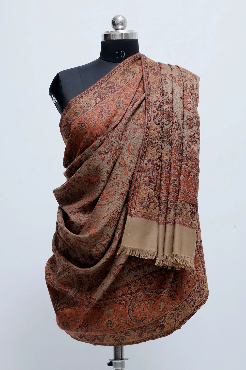 Beige Colour Jamawar Shawl With Highly Defined Borders And All Over Motifs Look Elegant.